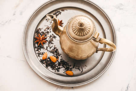 Teapot with tasty Turkish tea on light backgroundの写真素材