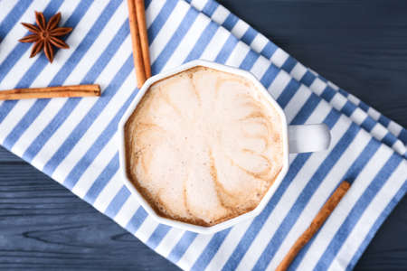 Cup of tasty latte on dark wooden backgroundの写真素材