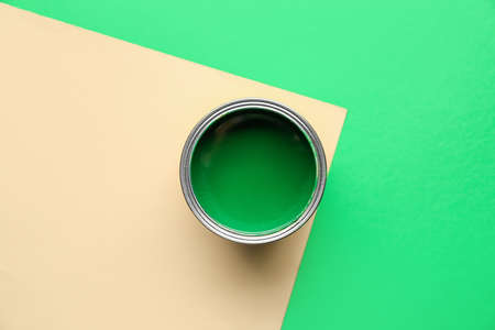 Can of green paint on color backgroundの写真素材