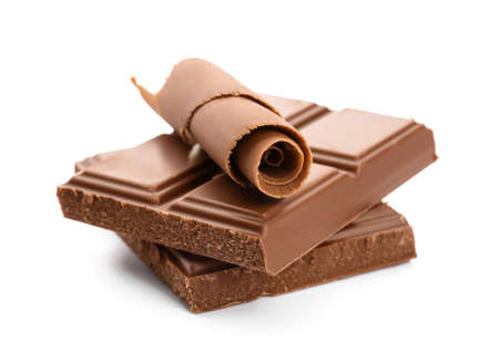Delicious chocolate curls and pieces on white background
