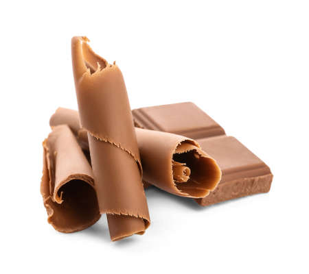 Delicious chocolate curls and pieces on white backgroundの写真素材
