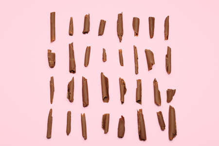 Delicious chocolate curls on color backgroundの写真素材