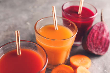 Composition with glasses of different smoothie on gray background, closeupの写真素材