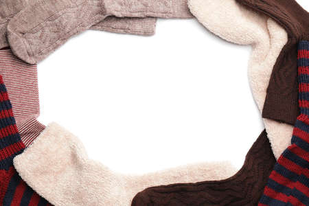 Frame made of warm socks on white backgroundの写真素材