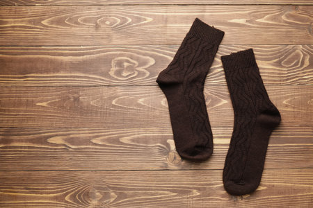 Warm socks on wooden backgroundの写真素材