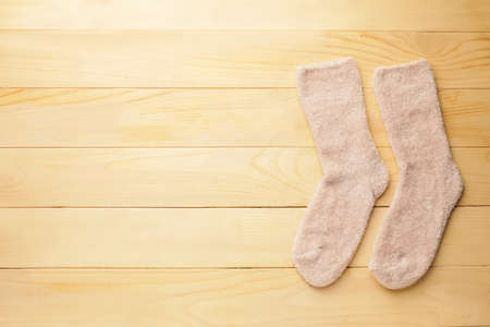 Warm socks on wooden backgroundの写真素材