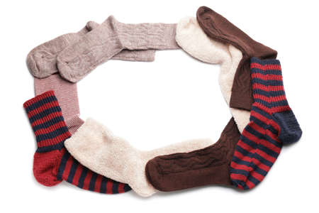 Frame made of warm socks on white backgroundの写真素材