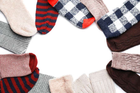 Frame made of warm socks on white backgroundの写真素材