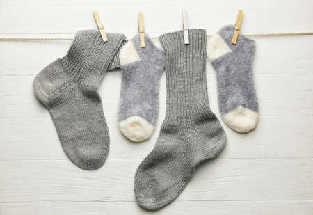 Rope with warm socks on white backgroundの写真素材