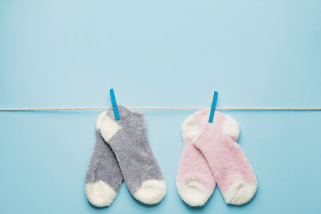 Rope with warm socks on color backgroundの写真素材