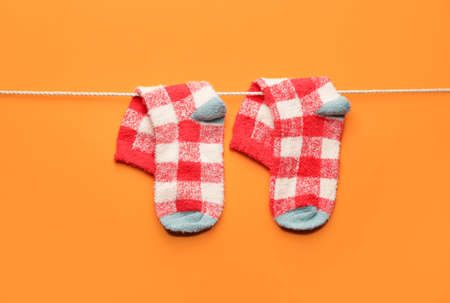 Rope with warm socks on color backgroundの写真素材