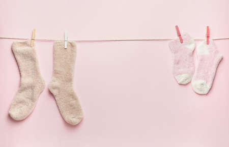 Rope with warm socks on color backgroundの写真素材