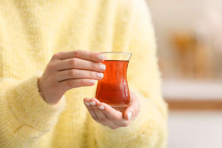 Woman with cup of hot tea, closeupの写真素材