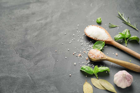 Spoons with salt on dark backgroundの写真素材