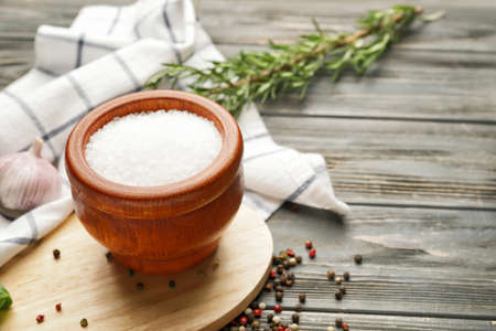 Composition with salt on wooden backgroundの写真素材