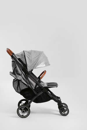 Modern baby stroller on white backgroundの写真素材