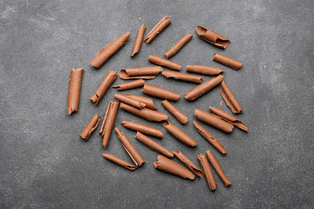 Delicious chocolate curls on dark backgroundの写真素材