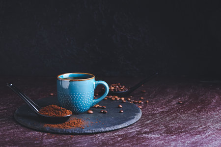 Cup of tasty hot coffee on dark backgroundの写真素材