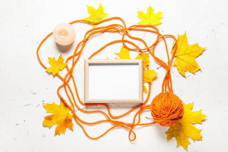 Beautiful autumn composition with empty frame on white backgroundの写真素材