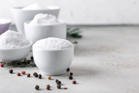 Bowls of salt on light backgroundの写真素材