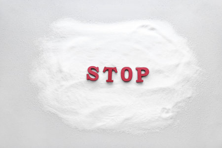 Salt and word STOP on light backgroundの写真素材