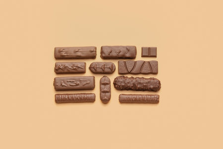 Different chocolate on color backgroundの写真素材