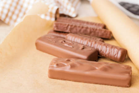 Sweet chocolate bars on table