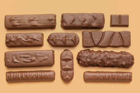 Different chocolate on color background