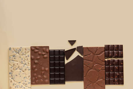 Different chocolate on color background