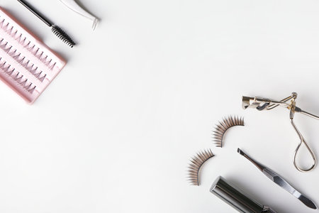 False eyelashes and tools on white backgroundの写真素材