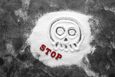 Composition with salt and word STOP on dark backgroundの写真素材