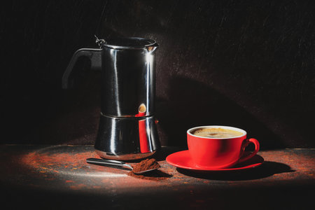 Cup with hot coffee on dark backgroundの写真素材