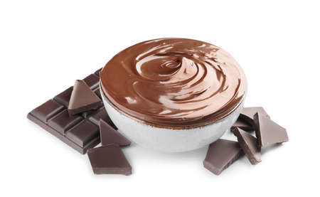 Bowl of tasty melted chocolate on white background