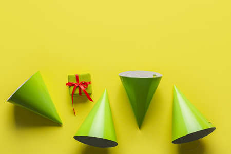 Composition with party hats on color backgroundの写真素材