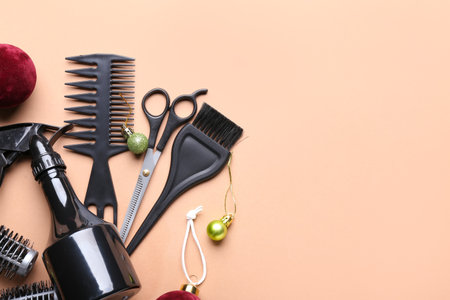 Christmas composition with hairdresser's tools on color backgroundの写真素材