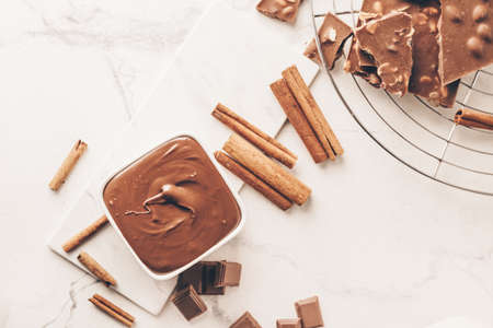 Composition with tasty melted chocolate on light background