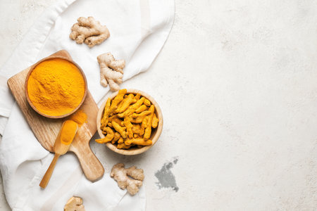 Composition with turmeric powder on grunge backgroundの写真素材