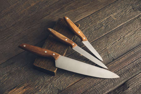 Set of knives on wooden backgroundの写真素材