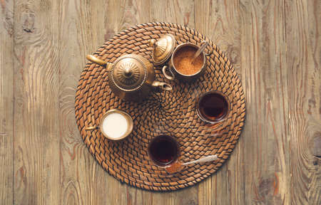 Composition with hot Turkish tea on wooden backgroundの写真素材