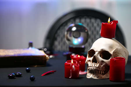 Human skull and candles on table of fortune tellerの写真素材