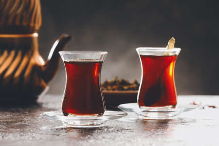 Cups with hot Turkish tea on dark backgroundの写真素材
