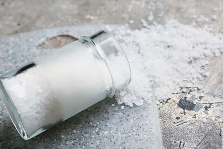 Jar with salt on grunge backgroundの写真素材