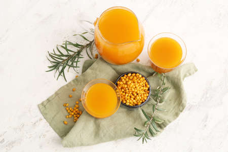 Healthy sea buckthorn juice on white backgroundの写真素材