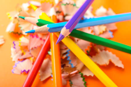 Composition with colorful pencils on color background