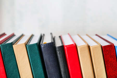 Stack of books on light backgroundの写真素材