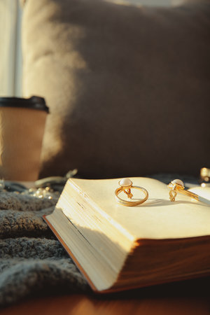 Open old book and accessories on table, closeupの写真素材