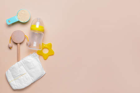 Baby bottle and accessories on color backgroundの写真素材