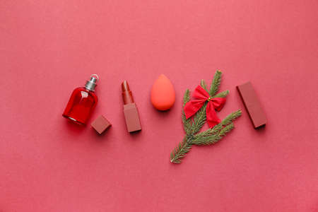 Christmas composition with cosmetics on color backgroundの写真素材