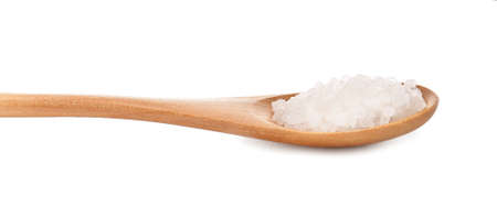 Spoon with salt on white backgroundの写真素材