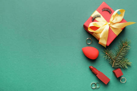 Christmas composition with cosmetics on color backgroundの写真素材